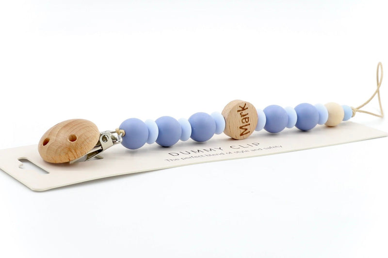 Twilight & baby blue personalised dummy clip with name ‘Mark’ engraved on wooden bead, made from soft silicone and safe for newborn use.