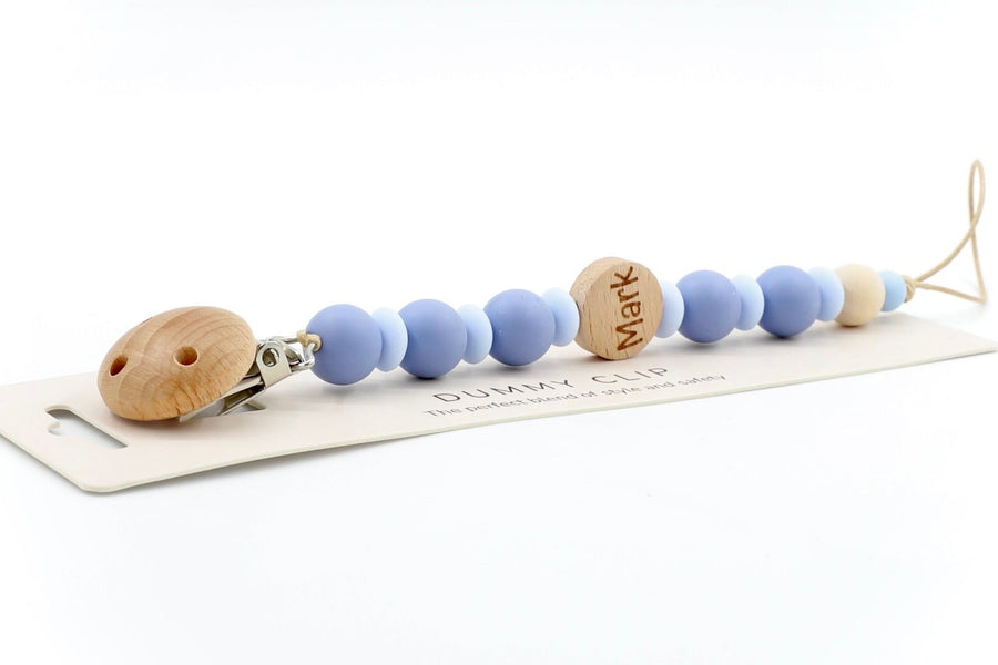 Twilight & baby blue personalised dummy clip with name ‘Mark’ engraved on wooden bead, made from soft silicone and safe for newborn use.