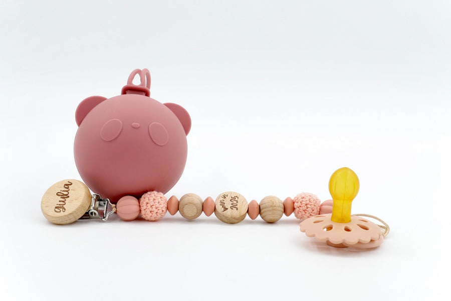 Cozy Knot Trio pacifier set in Rosewood pink with soft silicone bear case, crochet-accented clip, and matching vintage-style dummy