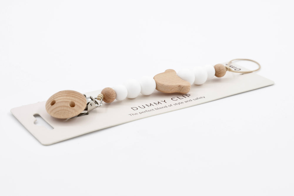 Silhouette Mouse pacifier clip with pure white silicone beads and natural wood mouse-shaped centrepiece, attached to wooden clasp on product card