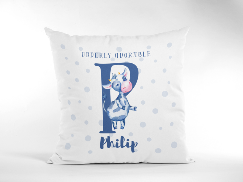 Mosaic Cow Cushion design with slogan "Udderly Adorable" and personalised baby name on a white background