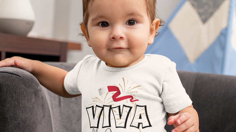 mockup featuring a baby boy with a short sleeved onesie at home