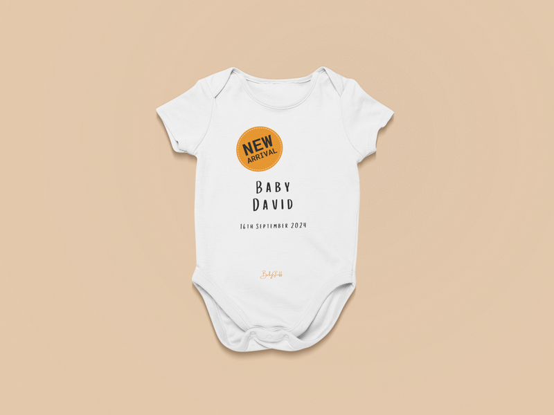 “New Arrival” Orange Badge Baby Grow | Short Sleeve Baby Grows by  – ["Baby Grow","Birthdate Celebration","New Arrival","Personalised"] from BabyStuff.com.mt